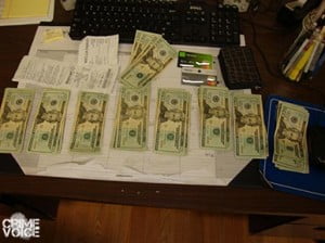 Confiscated cash, receipts, and stolen cards.