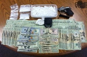 Drugs, a gun, and cash were seized in the traffic stop from Schumaker's truck.