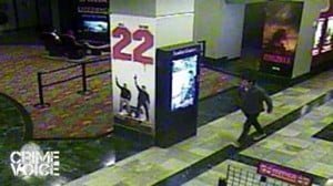 Surveillance photo shows suspect leaving the theater