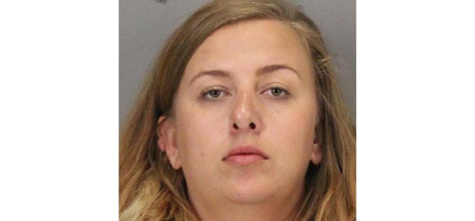 Suspicious woman in parking lot arrested for possession of illegal firearm