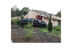 Man Drives SUV into Corner of House, Causing Big Damage