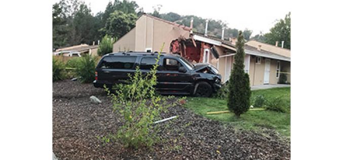 Man Drives SUV into Corner of House, Causing Big Damage