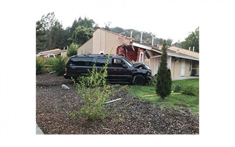 Man Drives SUV into Corner of House, Causing Big Damage