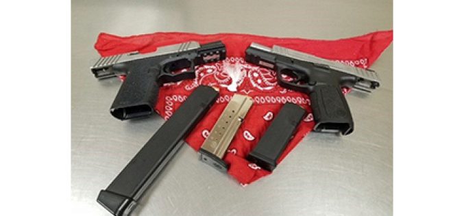 Three probationers arrested with two guns