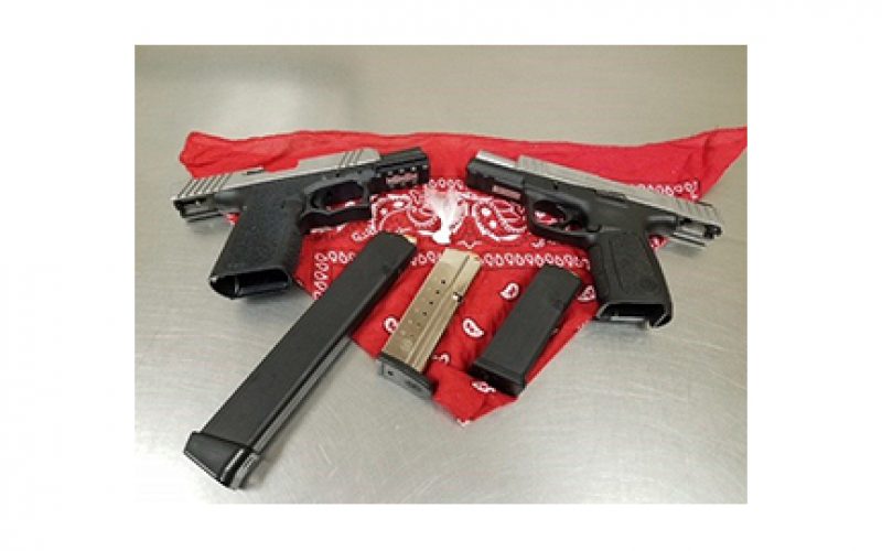 Three probationers arrested with two guns