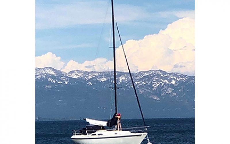 Two Girls take a dinghy for joyride on Lake Tahoe