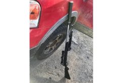 Pair arrested after stolen check, bolt-action rifle found in truck