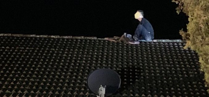 Man arrested after New Year’s Day rooftop standoff