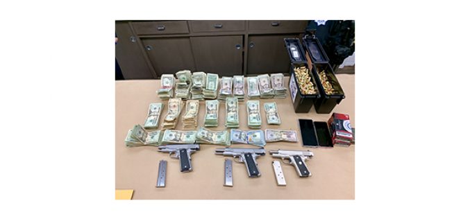 Three guns, drugs and cash seized in search warrant service