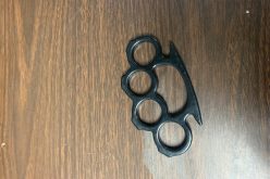 Man arrested after being caught with loaded firearm, brass knuckles