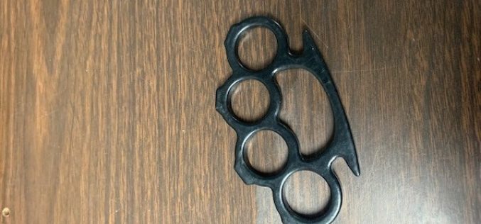 Man arrested after being caught with loaded firearm, brass knuckles