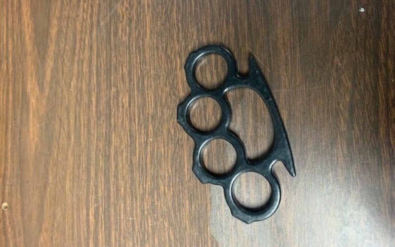 Man arrested after being caught with loaded firearm, brass knuckles