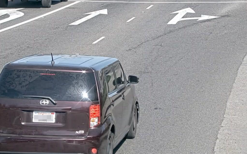 Couple try to flee in a purple boxy Scion