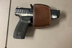 Traffic violation leads to the arrest of a parolee at large with a gun