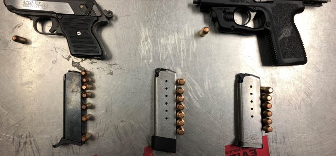 Two arrested carrying two guns