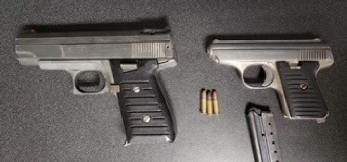 Man arrested with two guns, other traffic offenses