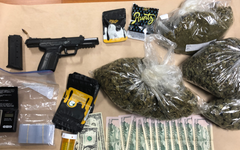 Handgun and drugs found after traffic stop