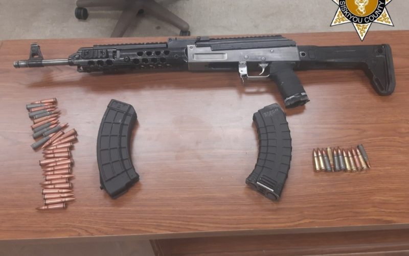 Driving with no license plates, but with meth, rifle, ammo