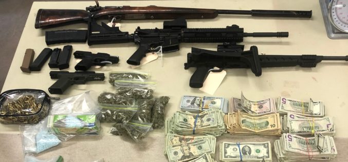 Cache of drugs, cash and five guns