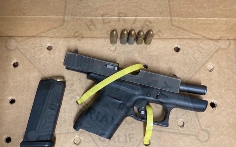 Man arrested after authorities reportedly find loaded, unregistered gun in vehicle